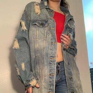 Oversized and distressed denim jacket